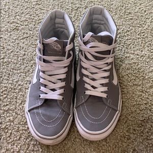 Grey and white high top vans